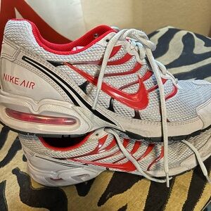 Nike Air Max Torch 4 running sneakers in gray and red.